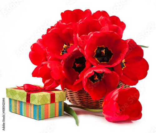 Basket with tulips and gift isolated