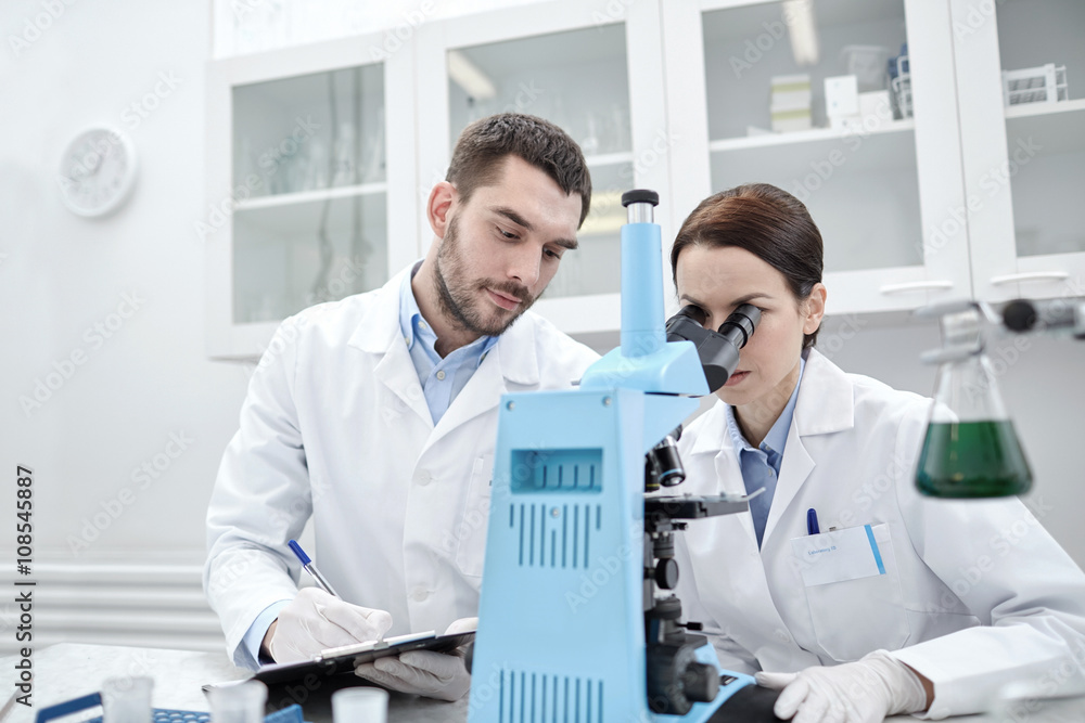 young scientists making test or research in lab young scientists making test or research in lab
