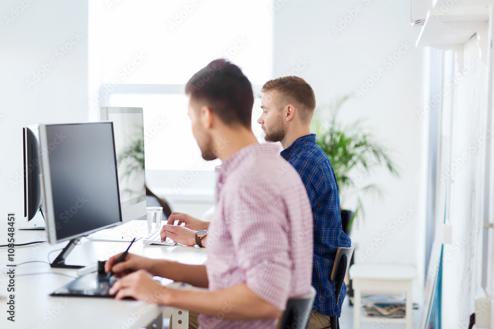 creative man or student with computer at office creative man or student with computer at office
