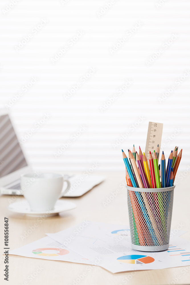 Fototapeta premium Office with with laptop, pencils and coffee