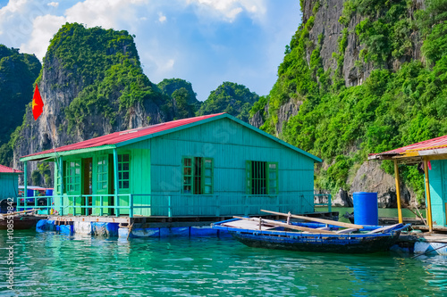Floating village near rock islands in Halong Bay