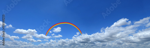 Rainbow on blue sky with cloud closeup,Panorama blue sky with cl