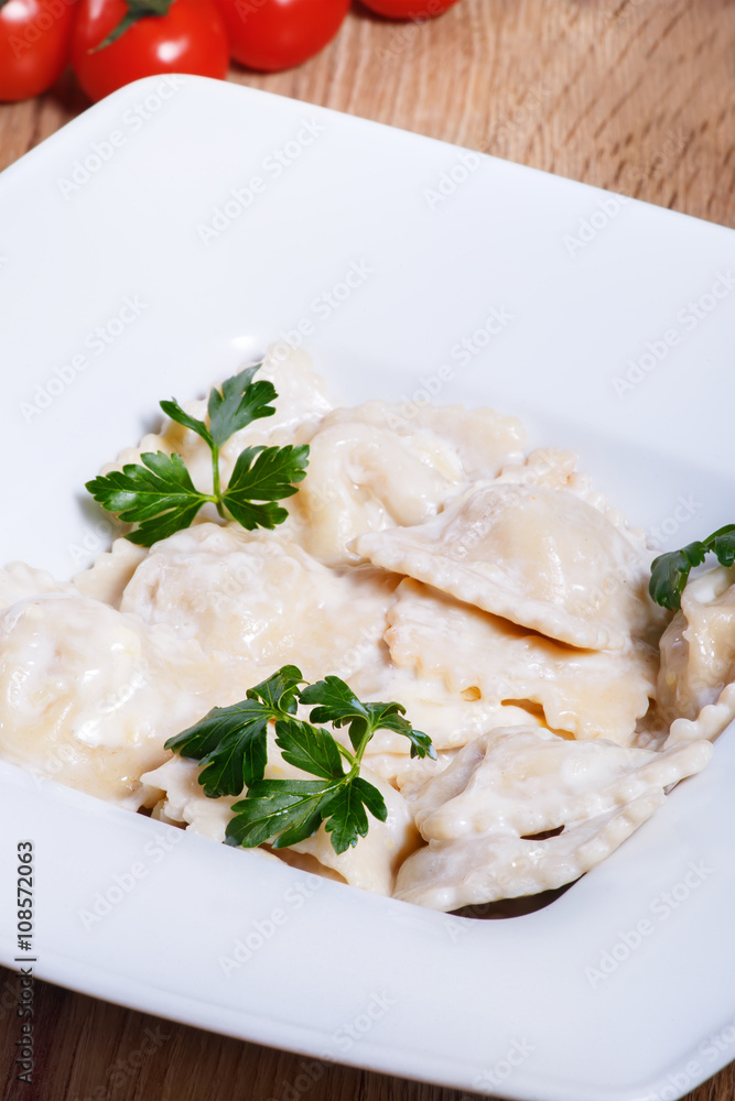 Dumplings with potatoes garnished with Sour Cream and Butter Dumplings with potatoes garnished with Sour Cream and Butter