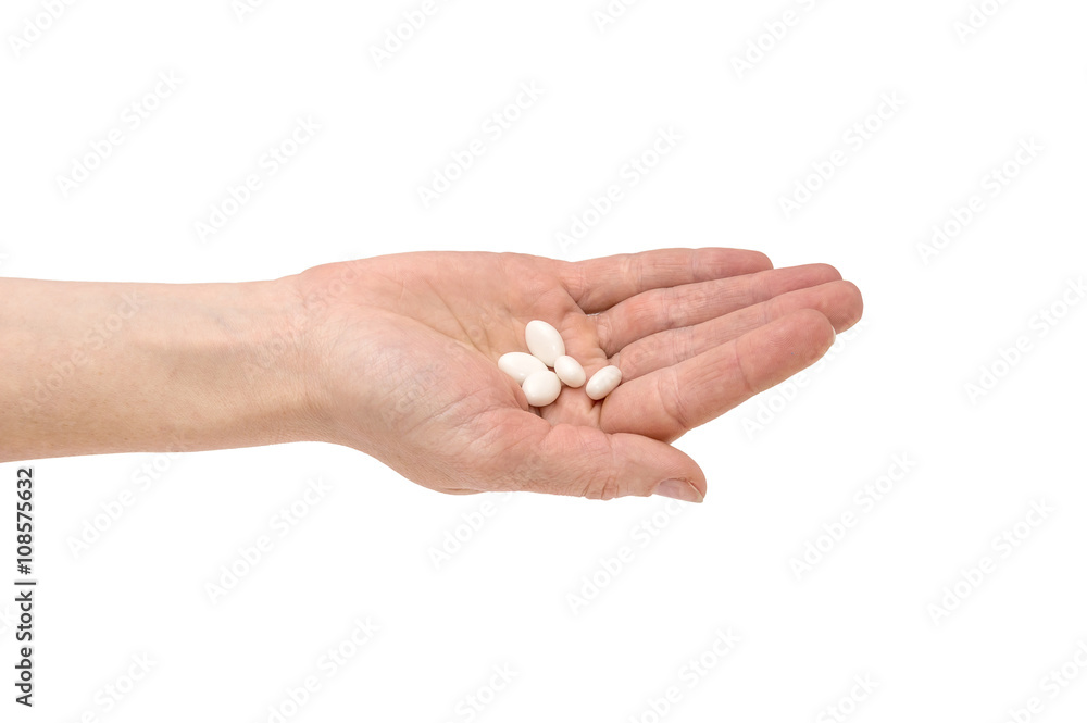Hand with pills isolated on white Hand with pills isolated on white