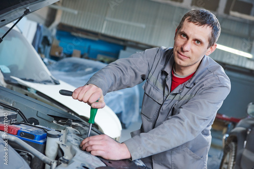 auto mechanic repair car in garage