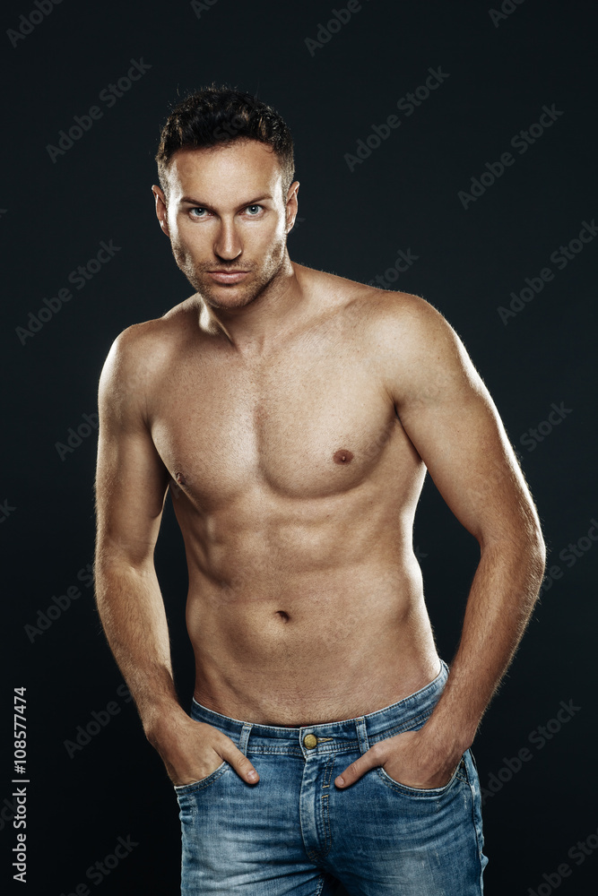 Handsome man shirtless posing in the studio Handsome man shirtless posing in the studio