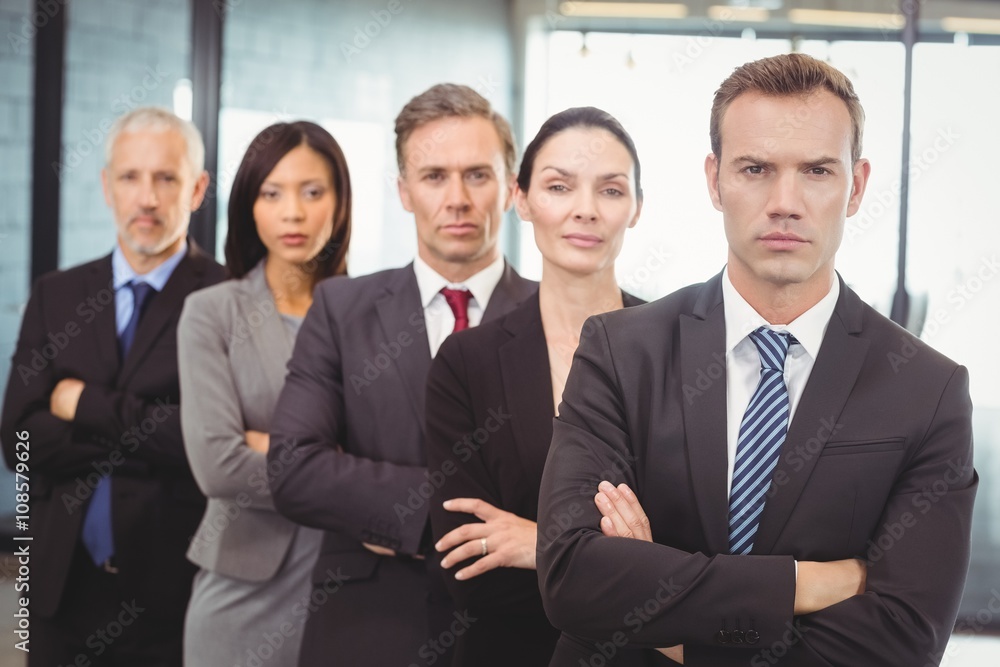Businesspeople standing with arms crossed Businesspeople standing with arms crossed