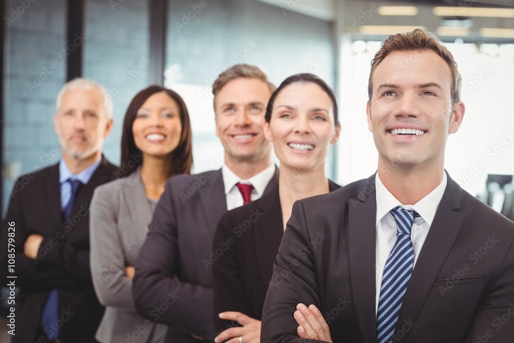 Businesspeople standing with arms crossed Businesspeople standing with arms crossed