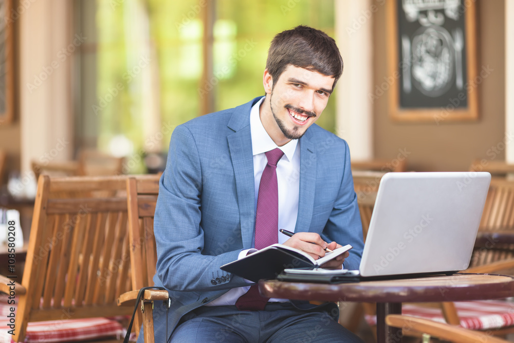 Businesman has a good idea and holding notebook Businesman has a good idea and holding notebook