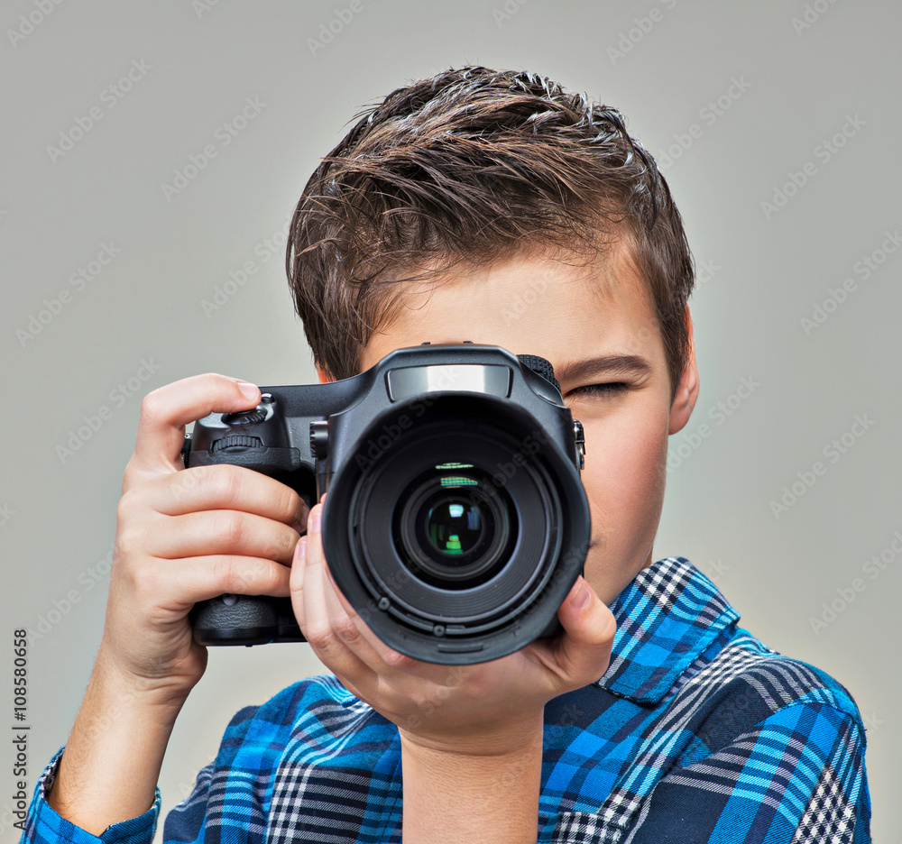 Boy with camera taking pictures. Boy with camera taking pictures.