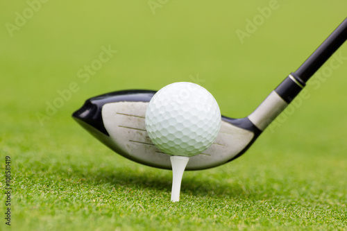 golf club behind the ball