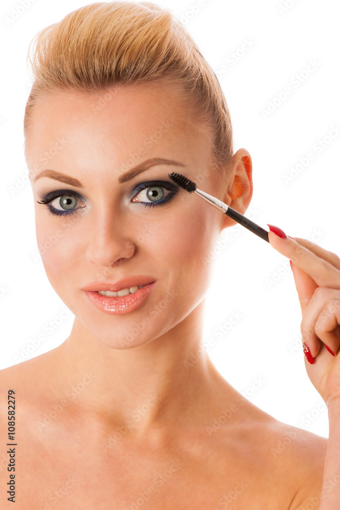 Portrait of woman holding beauty accessories, mascara, pauder br