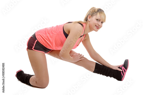 beautiful young sportswoman doing stretching exercises