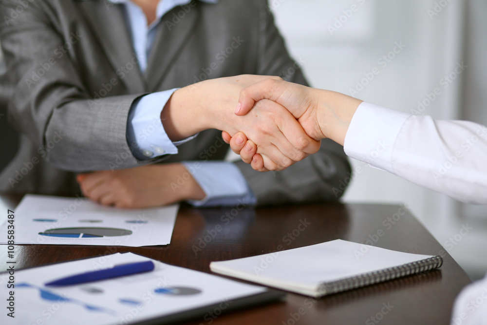 Close up  of unknown  business people handshake