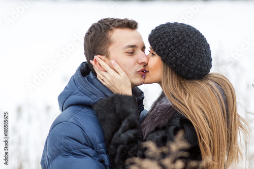 Happy Young Couple in Winter field