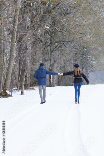 Couple walking in winter park