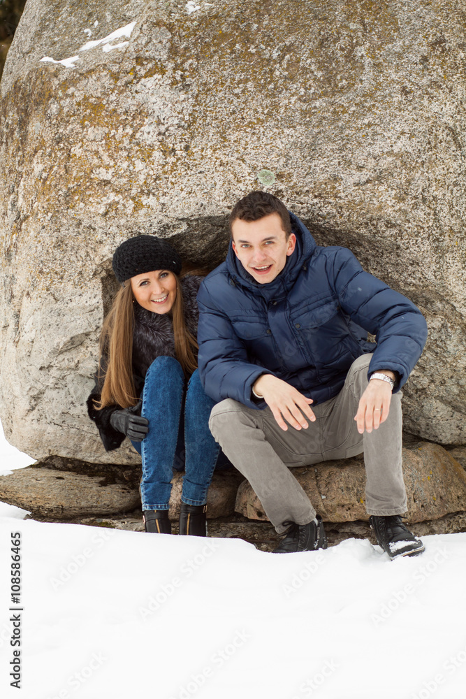 Happy Young Couple in Winter mountains Happy Young Couple in Winter mountains
