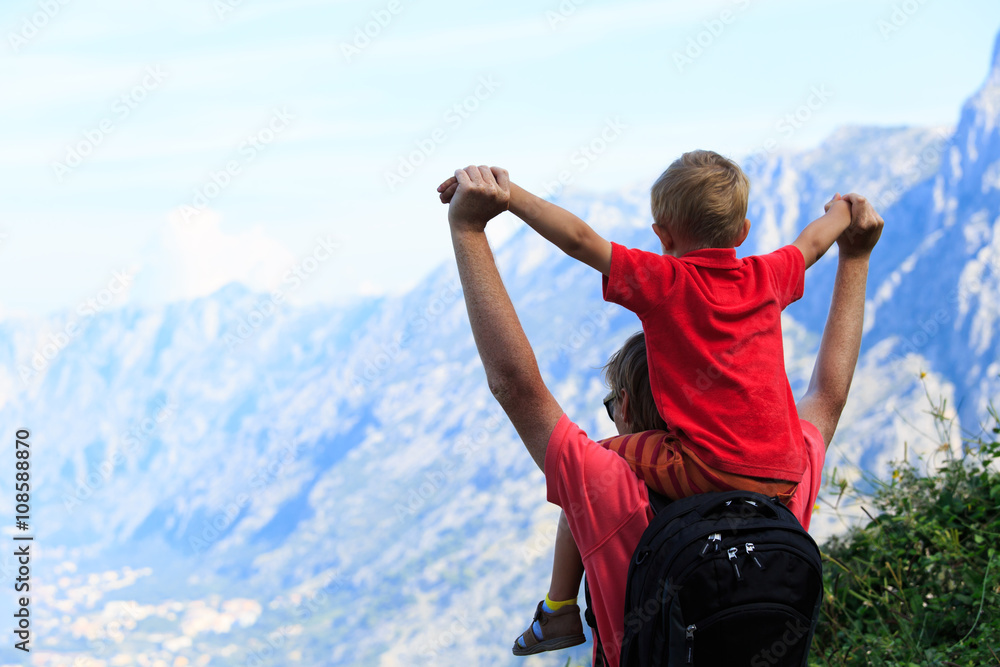 father and son travel hiking in mountains father and son travel hiking in mountains