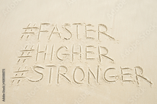 Faster, Higher, Stronger message modernized with social media hashtags in the sand