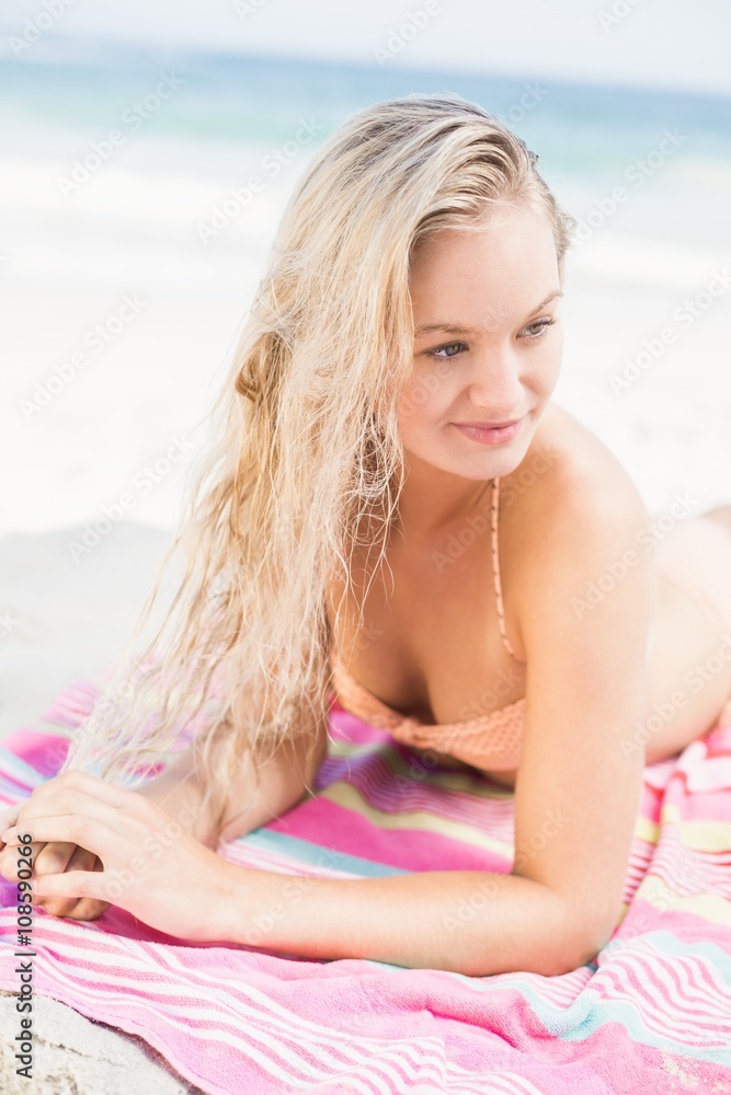 Pretty woman in bikini lying on the beach Pretty woman in bikini lying on the beach