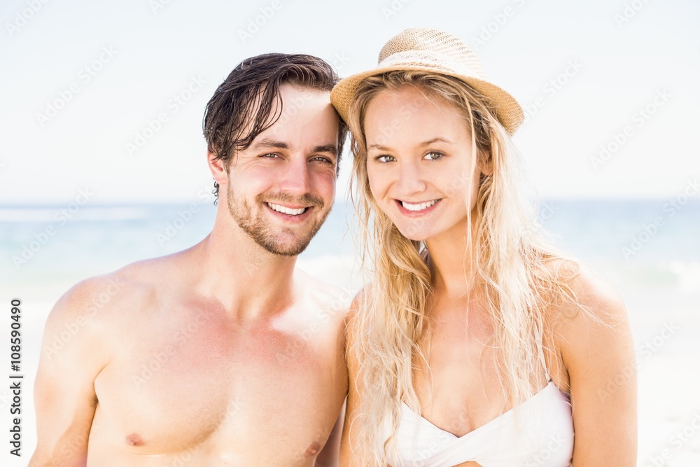 Portrait of young couple together on the beach Portrait of young couple together on the beach