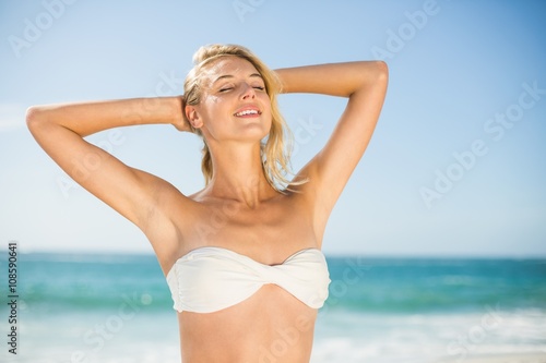 Smiling woman posing at the beach © WavebreakMediaMicro