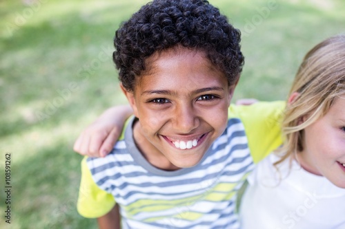 Happy boy standing in park