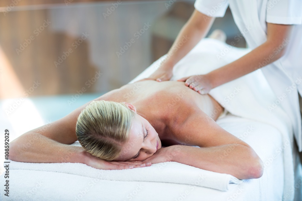 Woman receiving a back massage