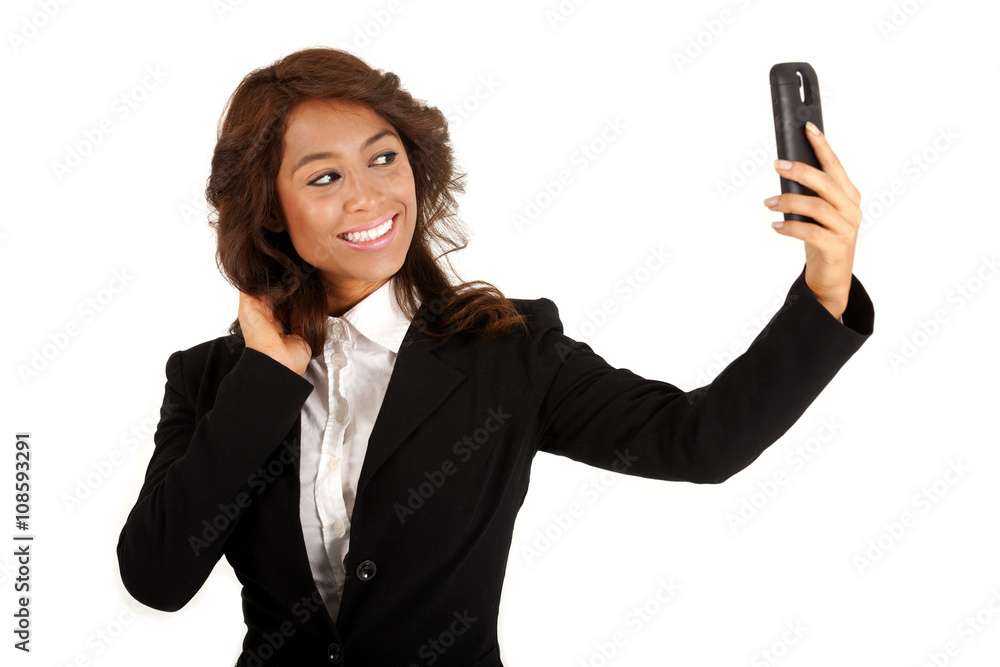 Business woman using a cellphone taking a selfie Business woman using a cellphone taking a selfie