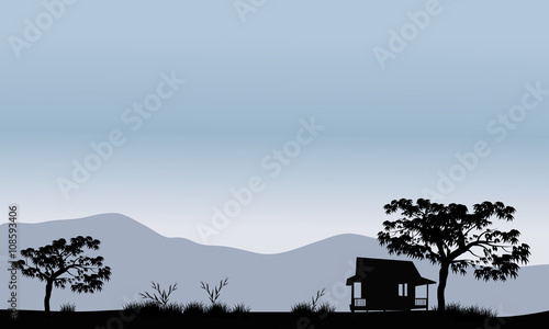 Silhouette of hut with trees