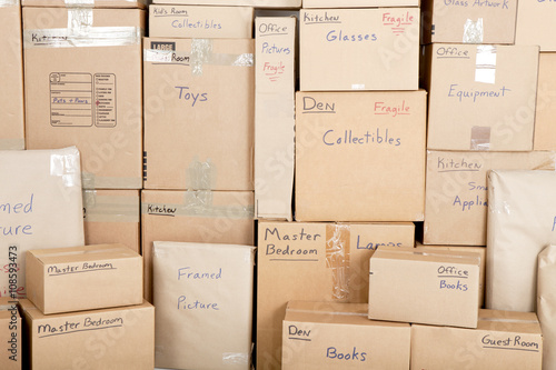 Wall with boxes labeled and ready for shipping photo