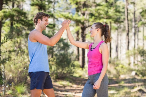 Healthy couple giving high five 