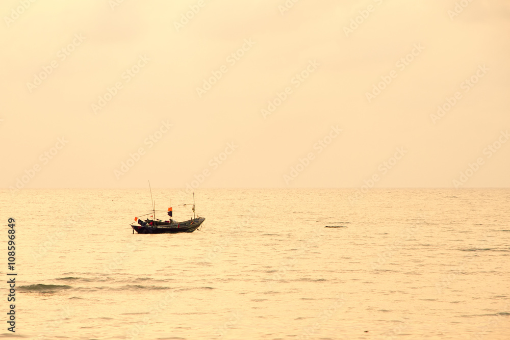Small lonely fishing boat floating on flat surface of adriatic s
