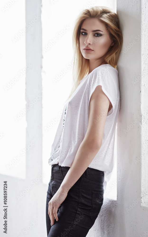 Blond female in a white t shirt. Blond female in a white t shirt.