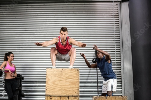 Fit people exercising together