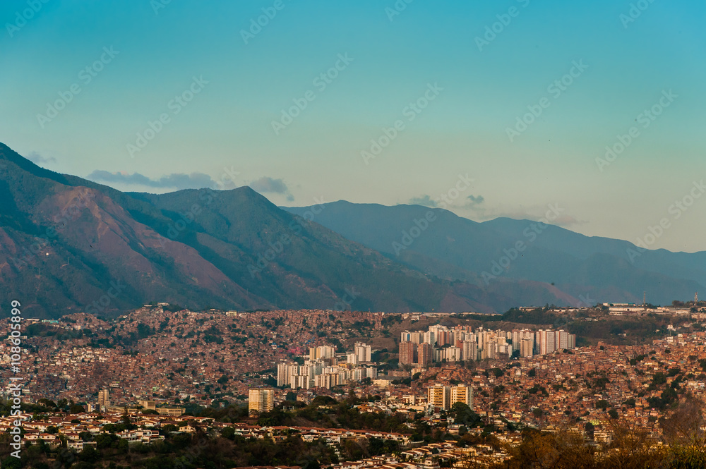 View of caracas slums at sunset with avila in background with clear blue sky