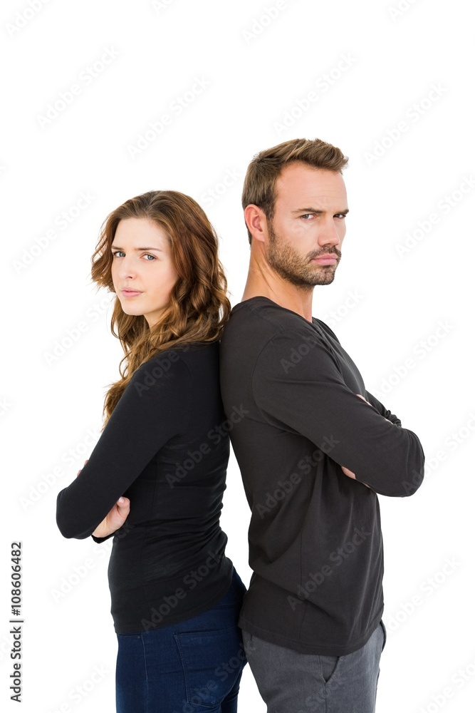 Depressed couple standing back to back Depressed couple standing back to back
