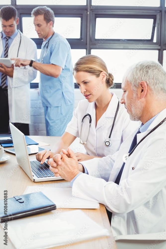 Medical team interacting in conference room Medical team interacting in conference room