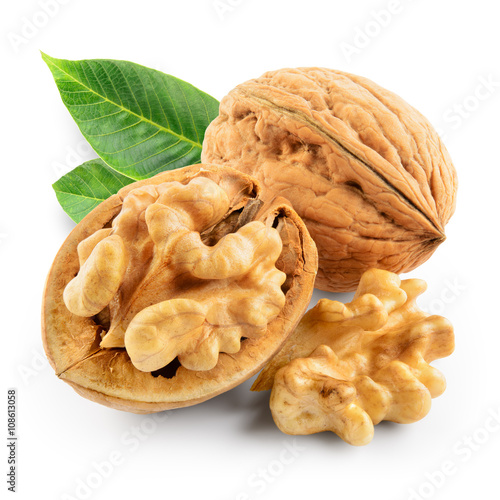 Walnuts with leaves isolated on white. With clipping path.