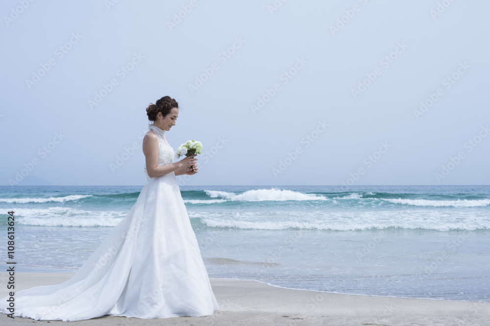 Beautiful bride you are taking wedding photos at the beach Beautiful bride you are taking wedding photos at the beach