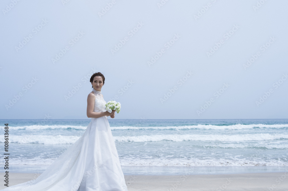 Bride're shooting the wedding photos on the beach Bride're shooting the wedding photos on the beach