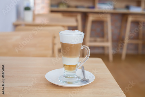 Cup of Hot Latte Coffee on wood table