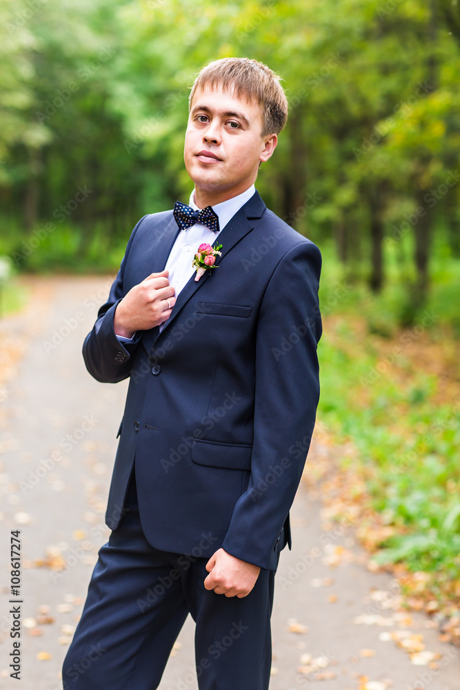 Sexy man in tuxedo and bow tie posing Sexy man in tuxedo and bow tie posing