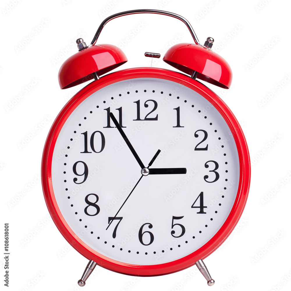 Round alarm clock shows five minutes to three Round alarm clock shows five minutes to three
