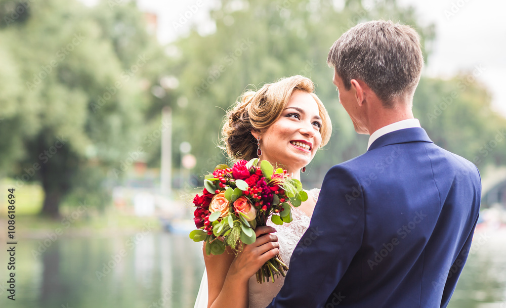 Stylish beautiful happy bride and groom, wedding celebrations outdoors Stylish beautiful happy bride and groom, wedding celebrations outdoors