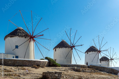 Panoramic view of white windmills and blue sky on the island of Mykonos, Cyclades, Greece
