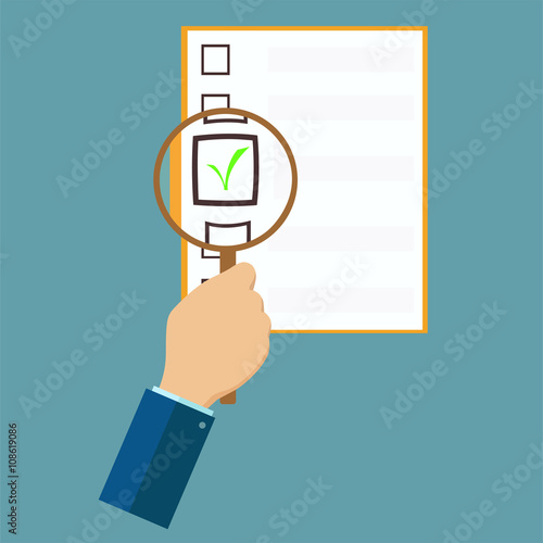 Hand holding magnifying glass.
