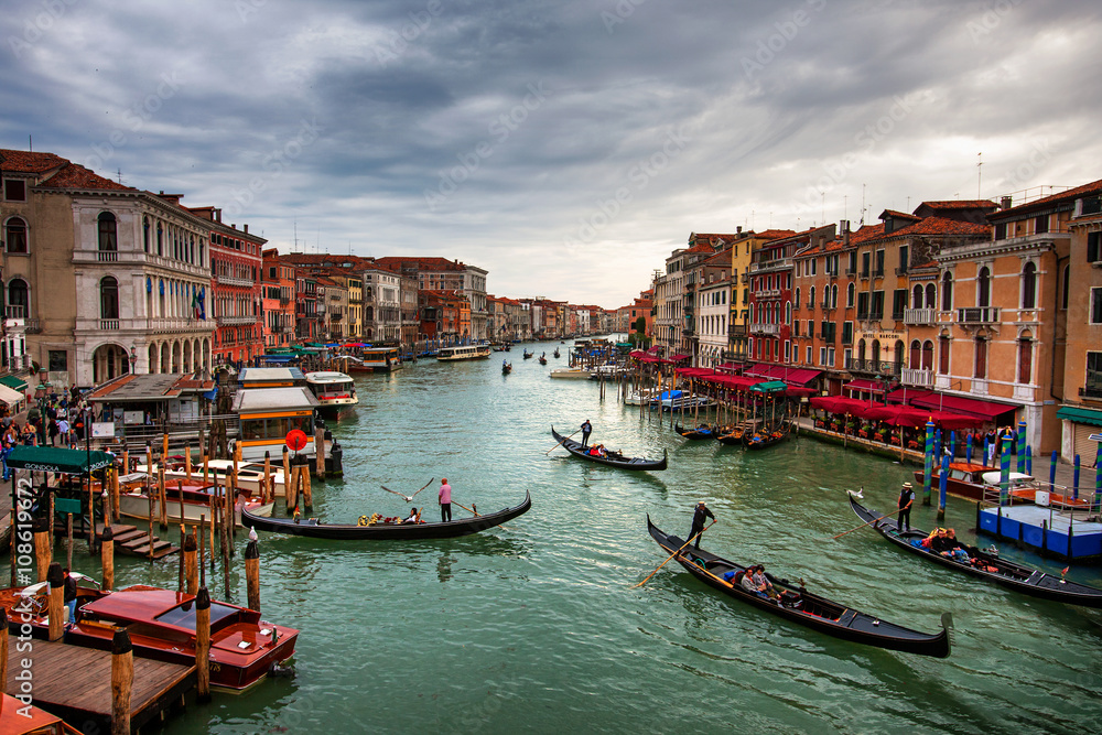 Boats and gondolas with tourists on the Grand Canal, Venice.