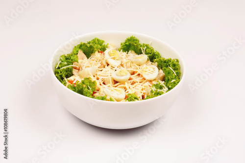Fresh salad with chicken breast, cheese and eggs