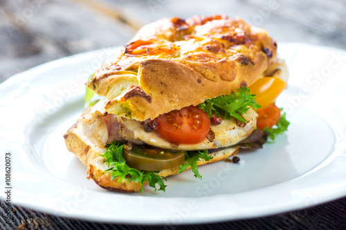 Delicious sandwich with grilled chicken and fresh crunchy vegetables
